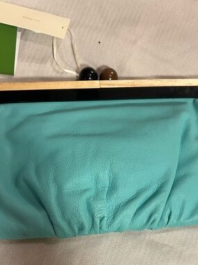 kate spade turquoise leather wristlet with gold plaque